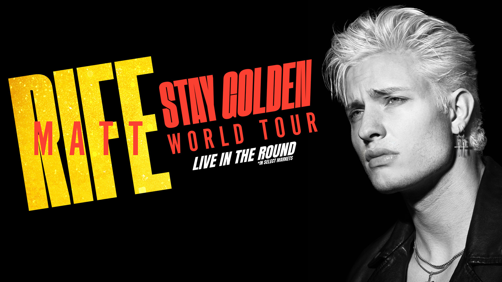 Matt performing comedy on stage